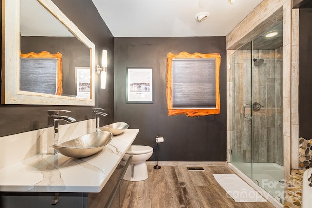 353 Whippoorwill Rd, Mooresville, NC 28117 - bathroom featuring wood finished floors, a shower stall, toilet, and vanity