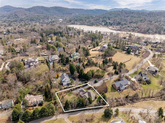 bird's eye view with a residential view and a water and mountain view