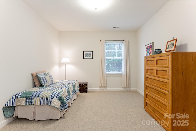 bedroom with carpet flooring and baseboards