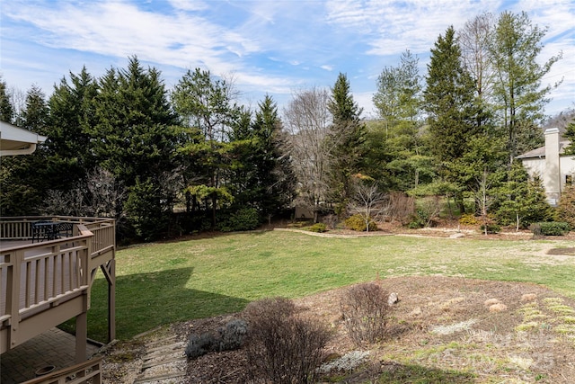 view of yard with a wooden deck