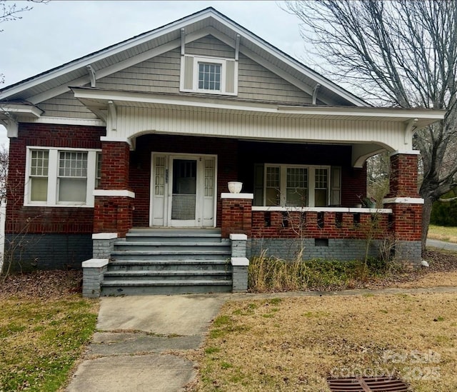 view of front of property featuring covered porch