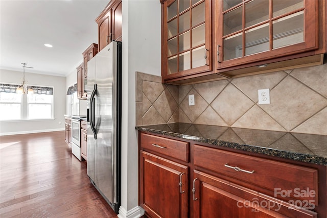 2439 Bergamot St, Fort Mill, SC 29708 - kitchen with dark wood finished floors, glass insert cabinets, backsplash, and stainless steel appliances