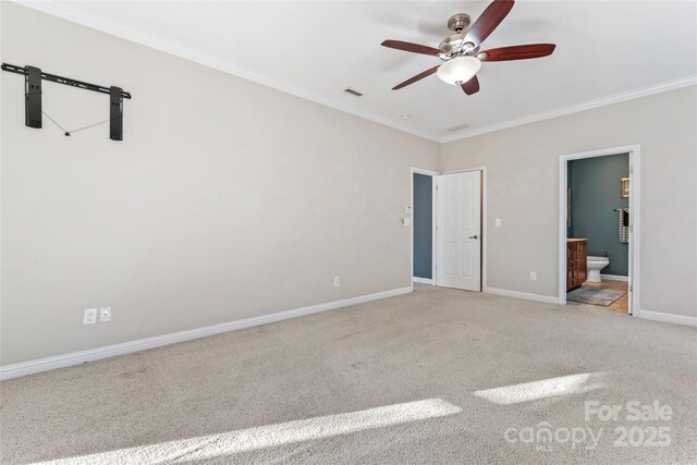 2439 Bergamot St, Fort Mill, SC 29708 - unfurnished bedroom with visible vents, crown molding, baseboards, carpet flooring, and ensuite bathroom
