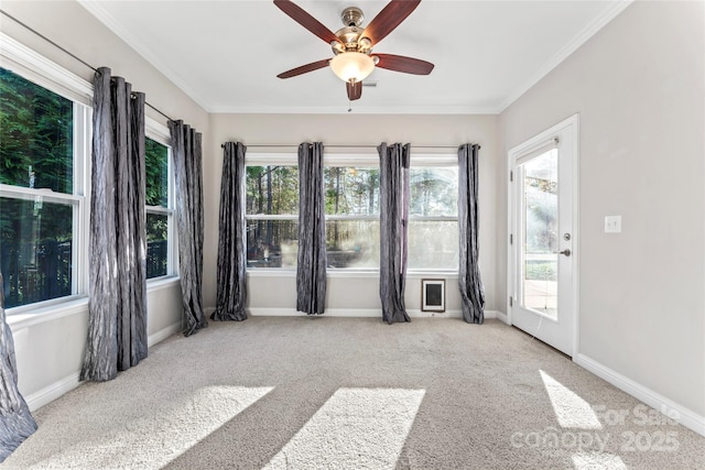 2439 Bergamot St, Fort Mill, SC 29708 - spare room with baseboards, carpet floors, ornamental molding, and a ceiling fan