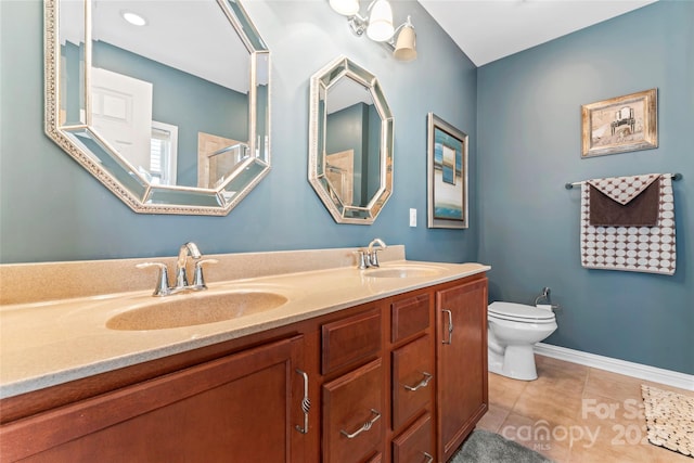 2439 Bergamot St, Fort Mill, SC 29708 - bathroom with tile patterned floors, toilet, double vanity, and a sink