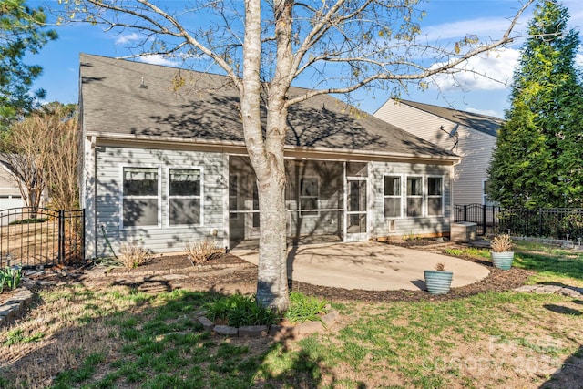 2439 Bergamot St, Fort Mill, SC 29708 - back of house with a patio, a shingled roof, fence, a yard, and a sunroom