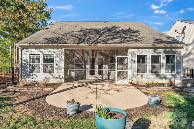 2439 Bergamot St, Fort Mill, SC 29708 - back of property with a patio area, fence, a sunroom, and roof with shingles