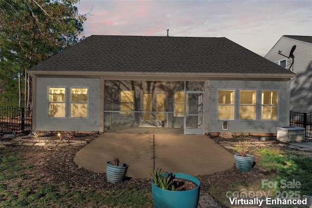 2439 Bergamot St, Fort Mill, SC 29708 - rear view of house featuring a patio area, a sunroom, and a shingled roof