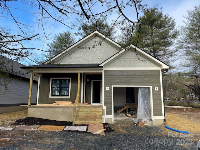 view of front facade featuring covered porch and board and batten siding