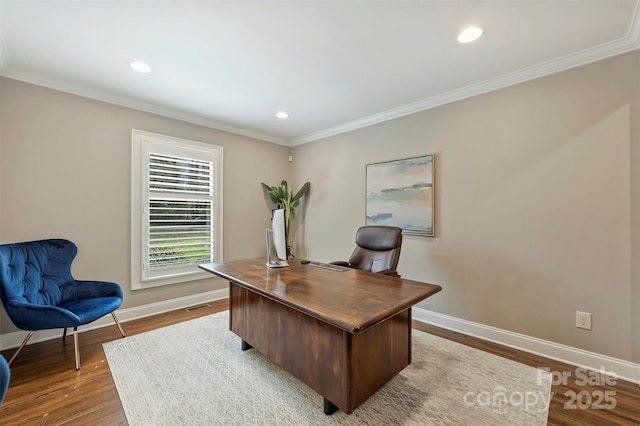 office area with recessed lighting, wood finished floors, visible vents, baseboards, and crown molding