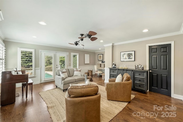 living area with french doors, crown molding, dark wood finished floors, recessed lighting, and baseboards