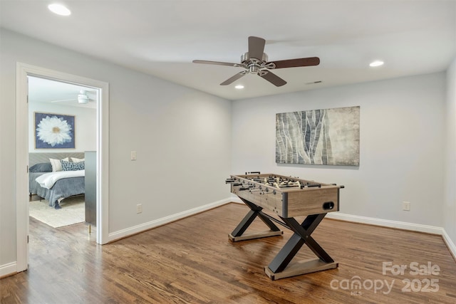 game room featuring a ceiling fan, recessed lighting, baseboards, and wood finished floors