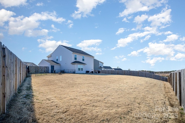 view of yard with a fenced backyard