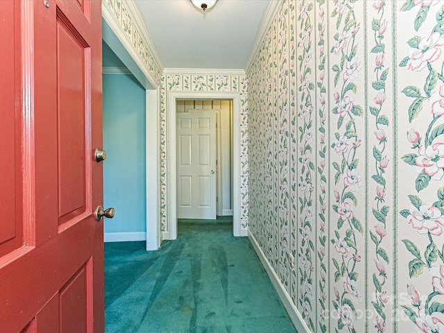 hallway with wallpapered walls, baseboards, crown molding, and carpet flooring