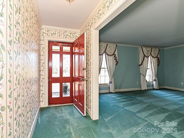 carpeted entryway featuring wallpapered walls, baseboards, and ornamental molding