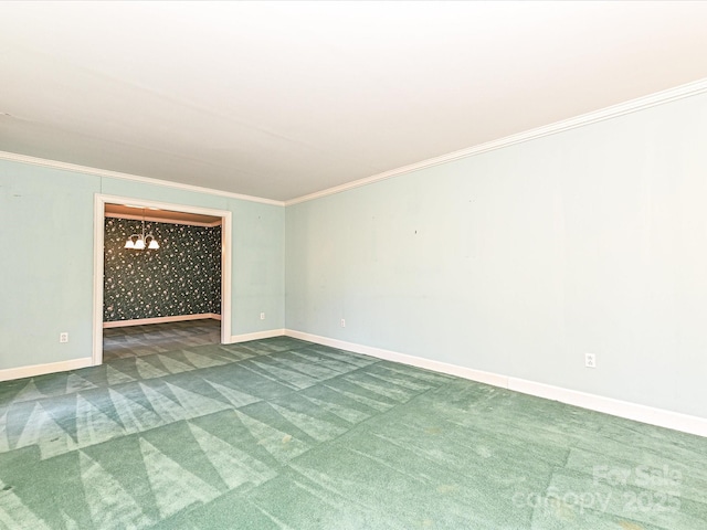 carpeted empty room with baseboards and ornamental molding