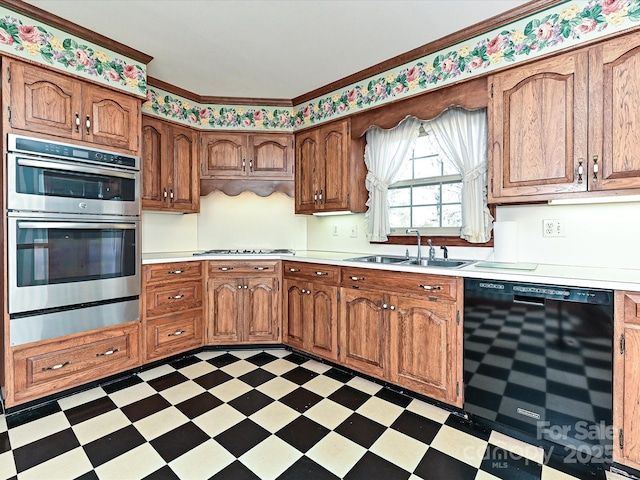 kitchen with dark floors, black dishwasher, light countertops, and a sink