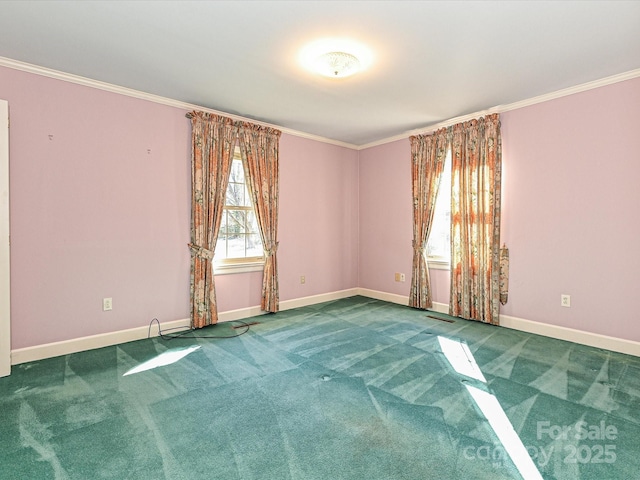 carpeted empty room featuring ornamental molding and baseboards