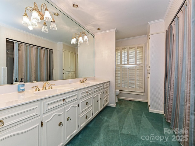 bathroom featuring a sink, double vanity, toilet, and crown molding