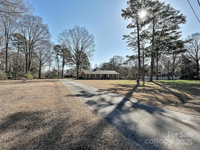 view of street with aphalt driveway