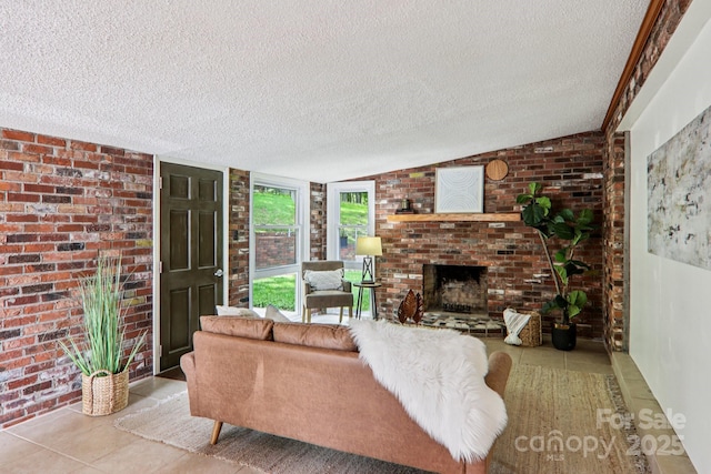 324 Old Leicester Hwy, Asheville, NC 28806 - living area featuring a textured ceiling, tile patterned flooring, a brick fireplace, brick wall, and lofted ceiling