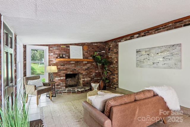 324 Old Leicester Hwy, Asheville, NC 28806 - tiled living room featuring a textured ceiling, a fireplace, and brick wall