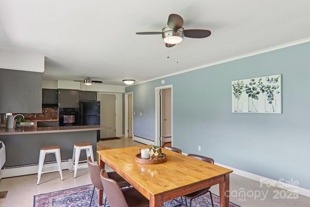 324 Old Leicester Hwy, Asheville, NC 28806 - dining area with ceiling fan, a baseboard radiator, and ornamental molding