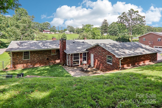 324 Old Leicester Hwy, Asheville, NC 28806 - rear view of property with a chimney, a patio area, brick siding, and roof with shingles