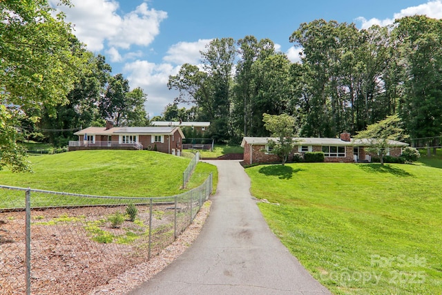 324 Old Leicester Hwy, Asheville, NC 28806 - ranch-style house featuring roof mounted solar panels, a chimney, asphalt driveway, and brick siding