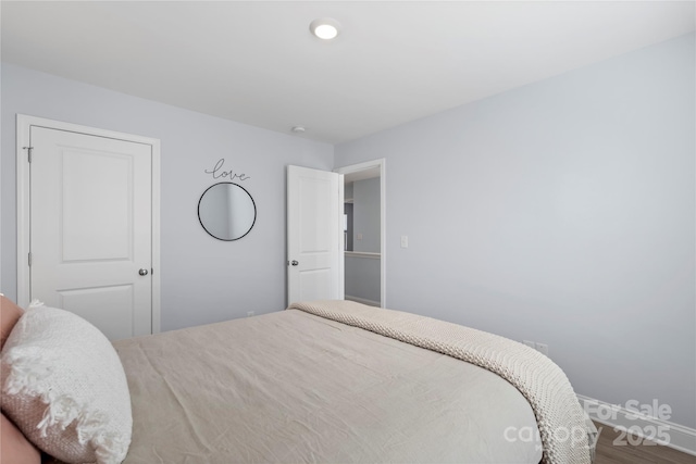 bedroom featuring wood finished floors