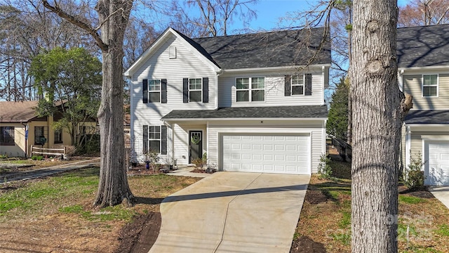 traditional home with a garage and driveway