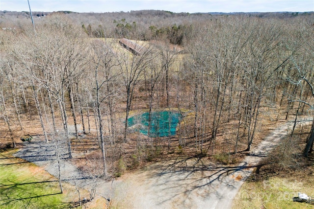 aerial view with a wooded view