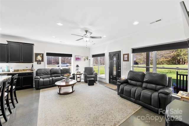 living area with ornamental molding, a ceiling fan, visible vents, and recessed lighting