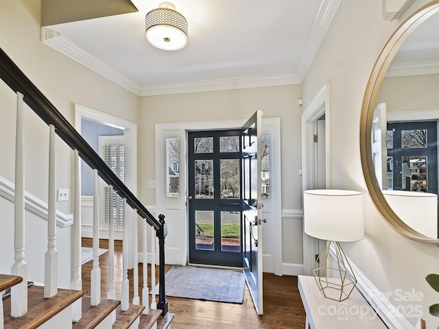 entryway featuring ornamental molding, stairway, dark wood finished floors, and baseboards