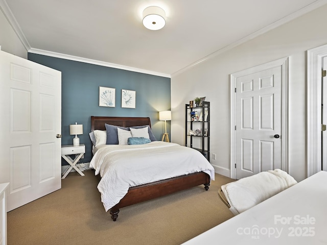 carpeted bedroom featuring ornamental molding and baseboards