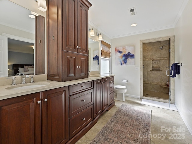 ensuite bathroom with a sink, ornamental molding, and connected bathroom