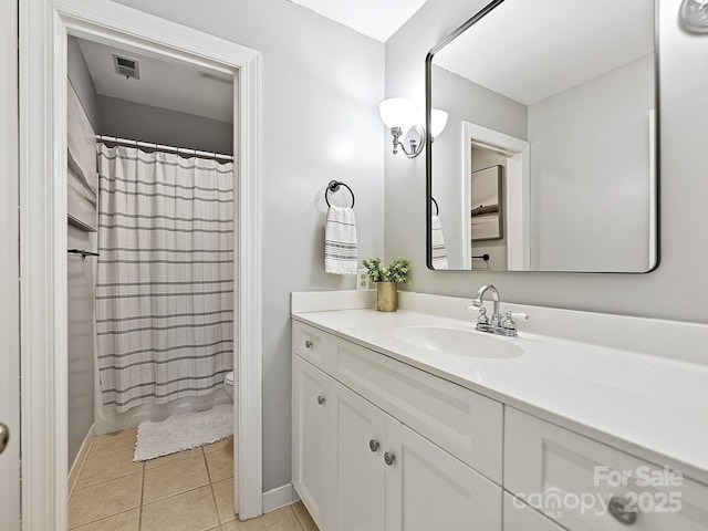 full bath featuring toilet, a shower with shower curtain, vanity, visible vents, and tile patterned floors