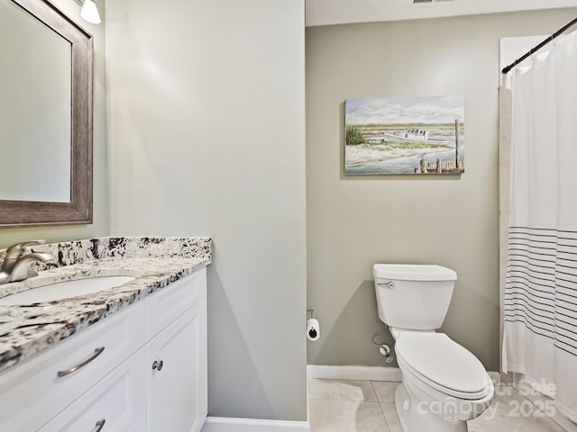 bathroom featuring toilet, visible vents, baseboards, vanity, and tile patterned floors