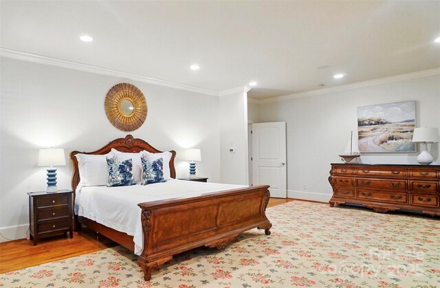 bedroom with recessed lighting, wood finished floors, and ornamental molding