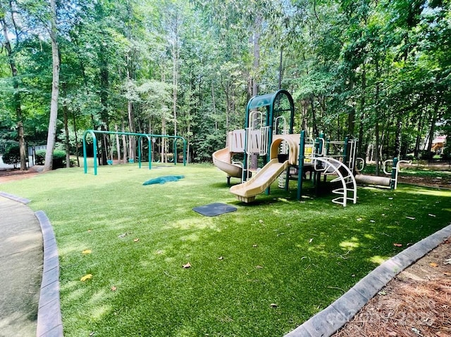 community playground featuring a lawn