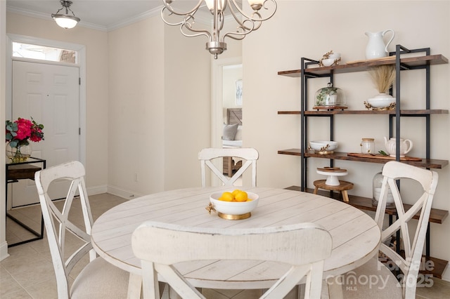 dining space featuring crown molding, a notable chandelier, light tile patterned floors, and baseboards