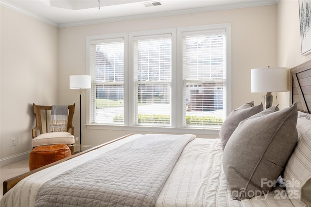 bedroom with visible vents, baseboards, carpet floors, and ornamental molding