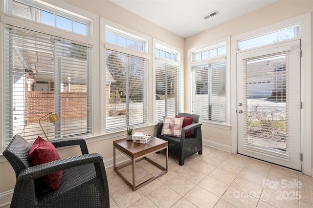 sunroom with visible vents and a wealth of natural light