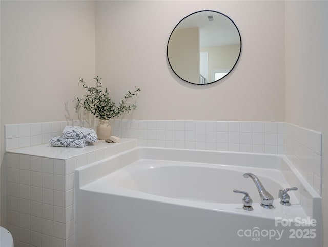 full bathroom with a garden tub