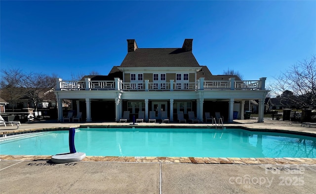 pool with a patio area