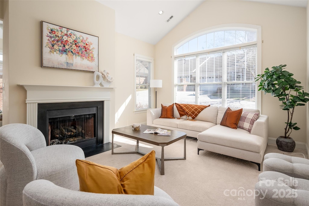 2937 Bellasera Way, Matthews, NC 28105 - living area with a fireplace with flush hearth, baseboards, visible vents, and vaulted ceiling