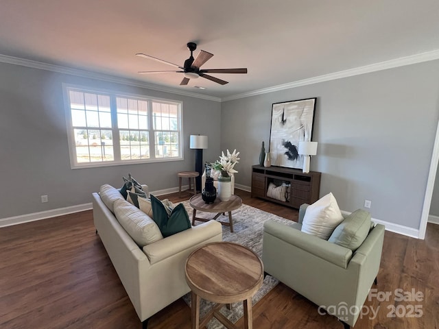 living room featuring dark wood-type flooring, ornamental molding, baseboards, and ceiling fan