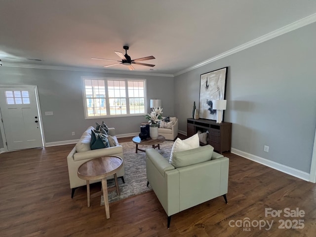 living area featuring baseboards, dark wood finished floors, and crown molding