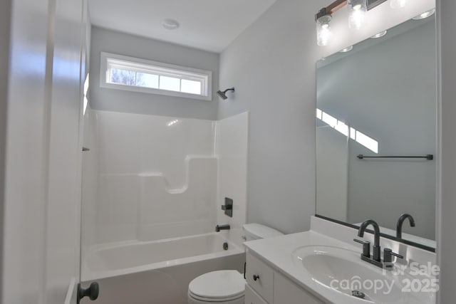 full bath with tub / shower combination, vanity, and toilet