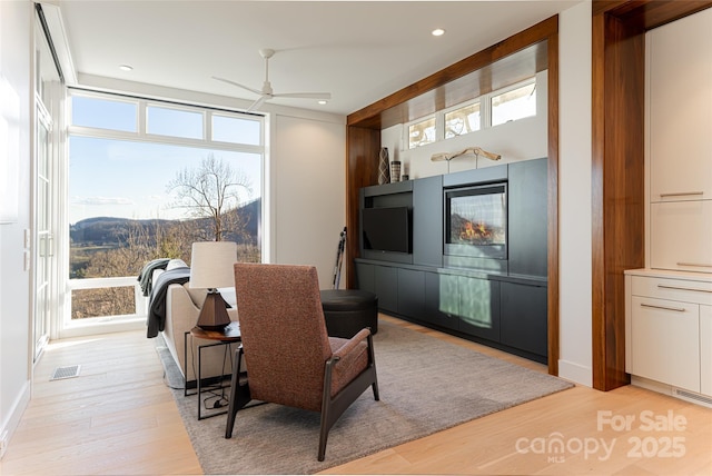 dining space featuring a ceiling fan, light wood-type flooring, visible vents, and recessed lighting